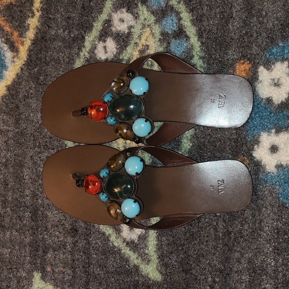 Brown leather sandals with colorful stones